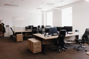 An office space with desks, chairs, and computers. This is to show the commercial places where heating projects could be done this summer.